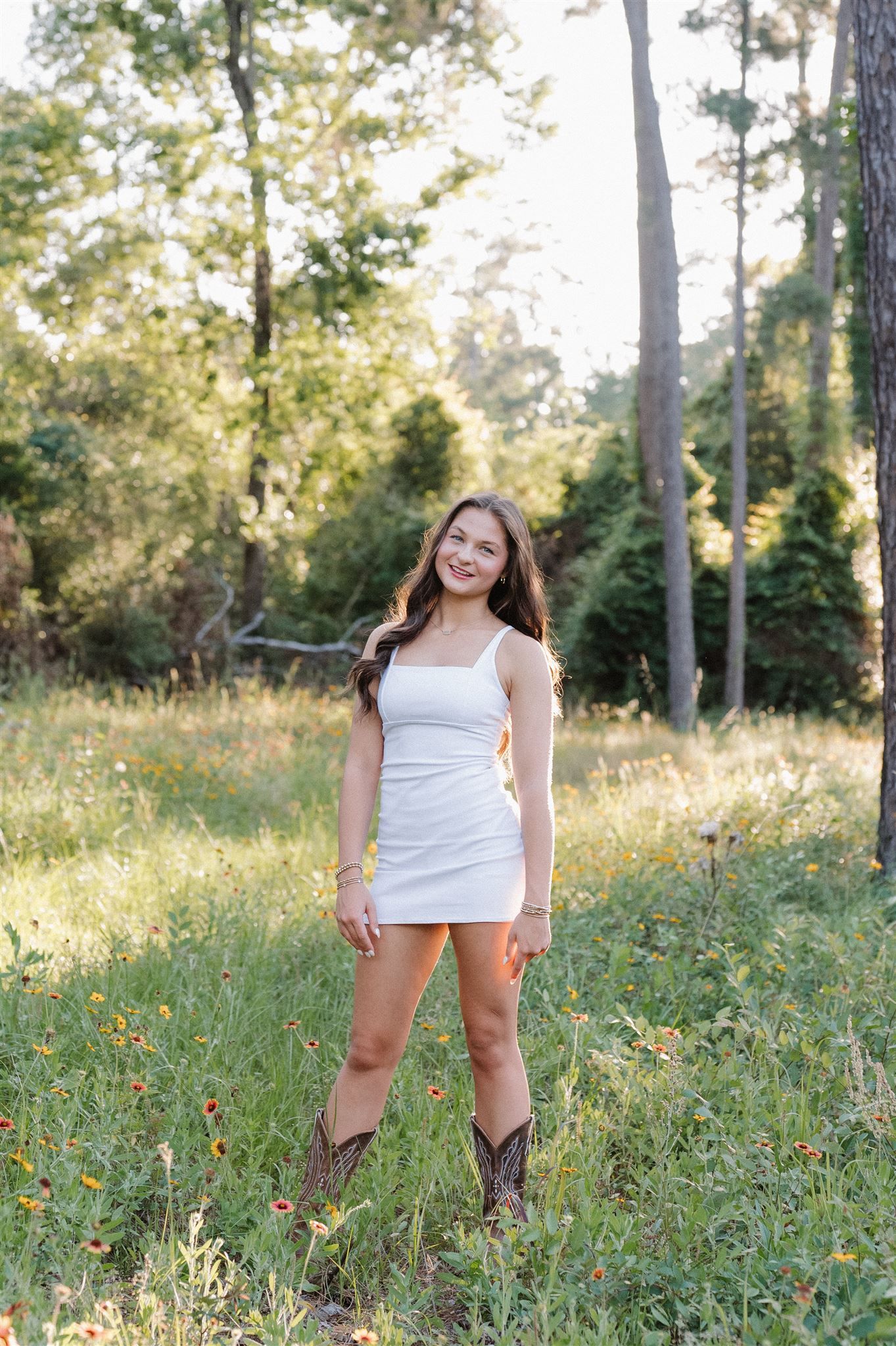 College Park High School senior in white dress during golden hour in The Woodlands