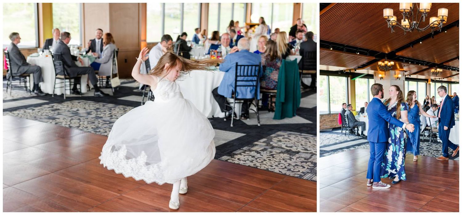 A bride in a white lace dress dances on a wood floor while guests watch at a reception in an elegant venue.