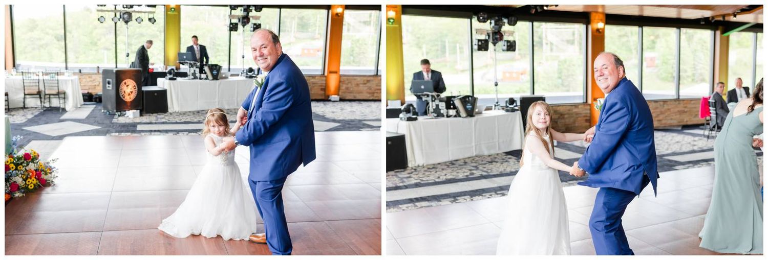 A couple dances together during their first dance at an indoor wedding reception venue.