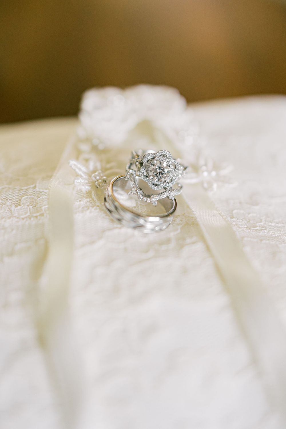 Stunning diamond engagement ring resting on delicate white lace fabric in Orange County, New York.