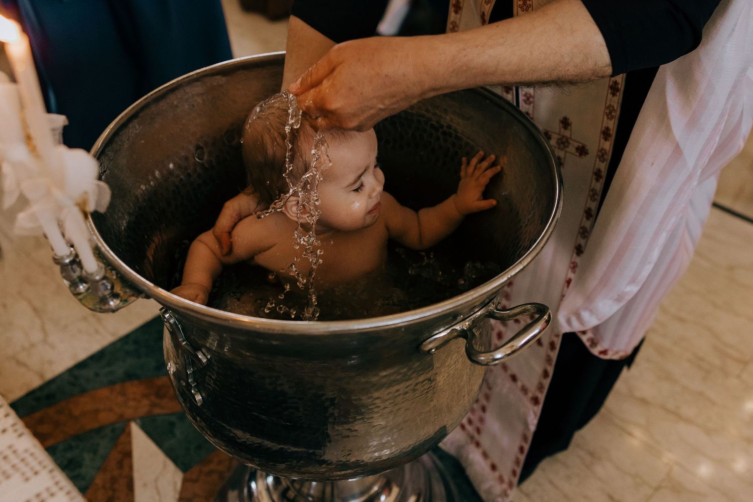 Christening moments during photographing a baptism in Cyprus.