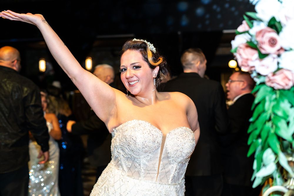 The bride posing on the dance floor.