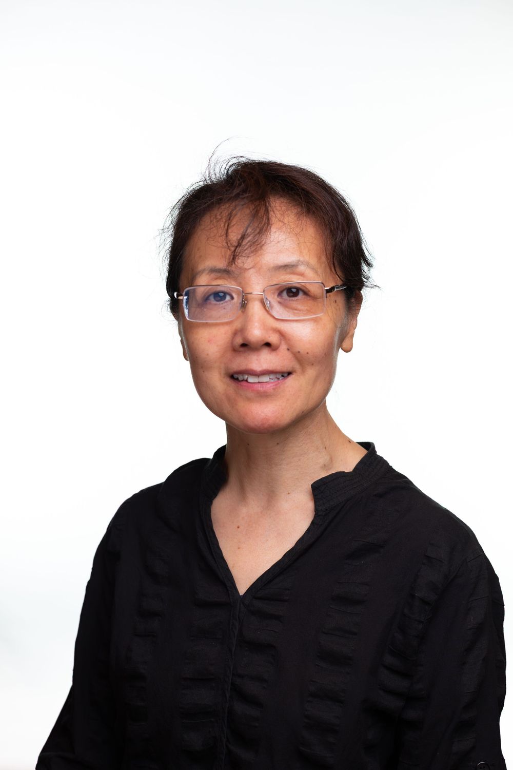 A series of five similar headshots showing a person in a black shirt against a white background.