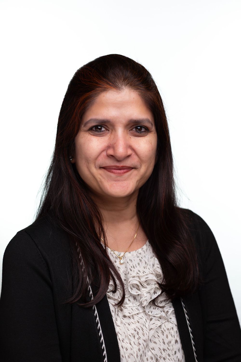 Professional headshots of someone in a black blazer and white lace top shown from different angles.
