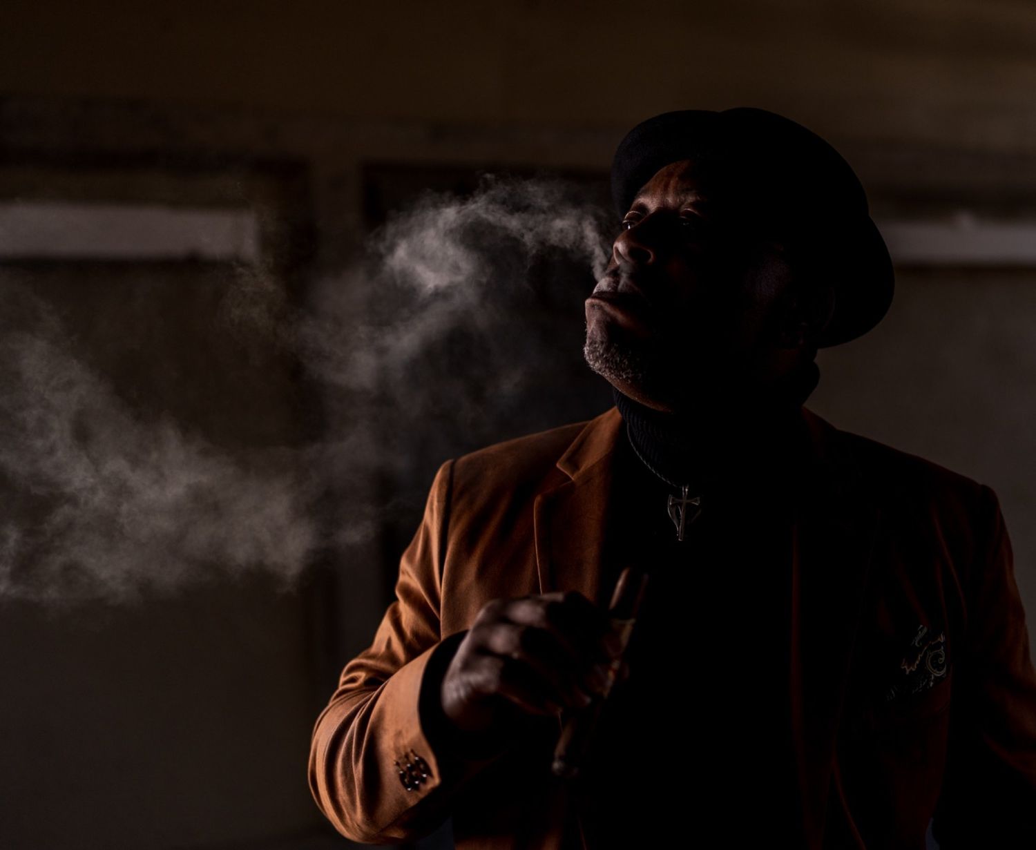 Close up of cigar smoke while Randy Daye demonstrates proper cigar smoking technique.
