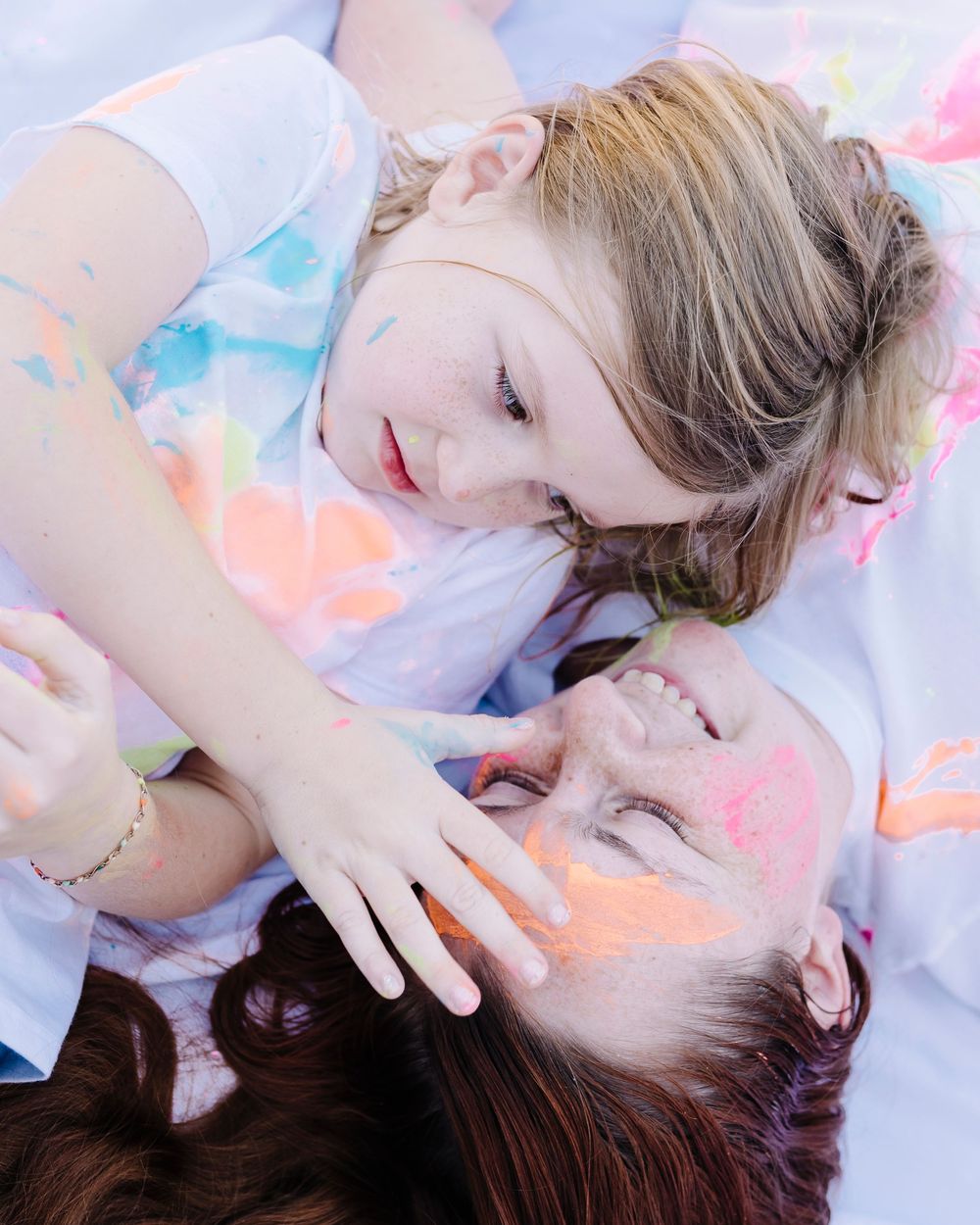 A tender moment captured in soft lighting with gentle embraces and intimate poses.