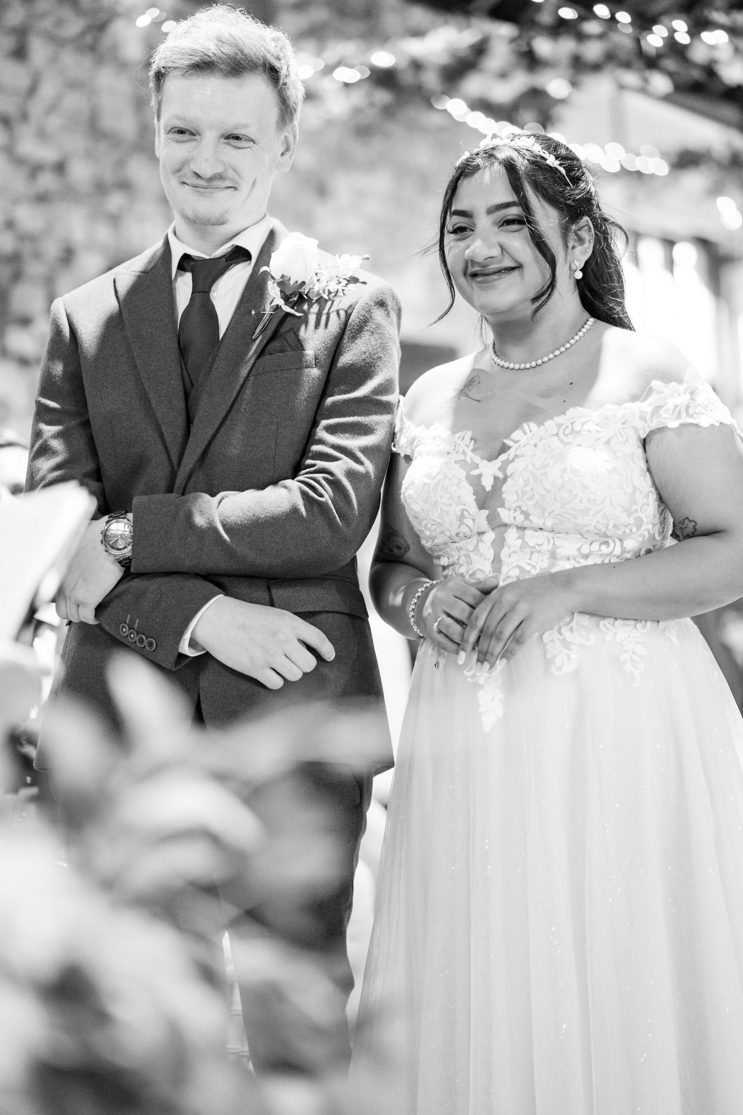 Black and white wedding photo sequence showing couple in formal attire walking together outdoors.