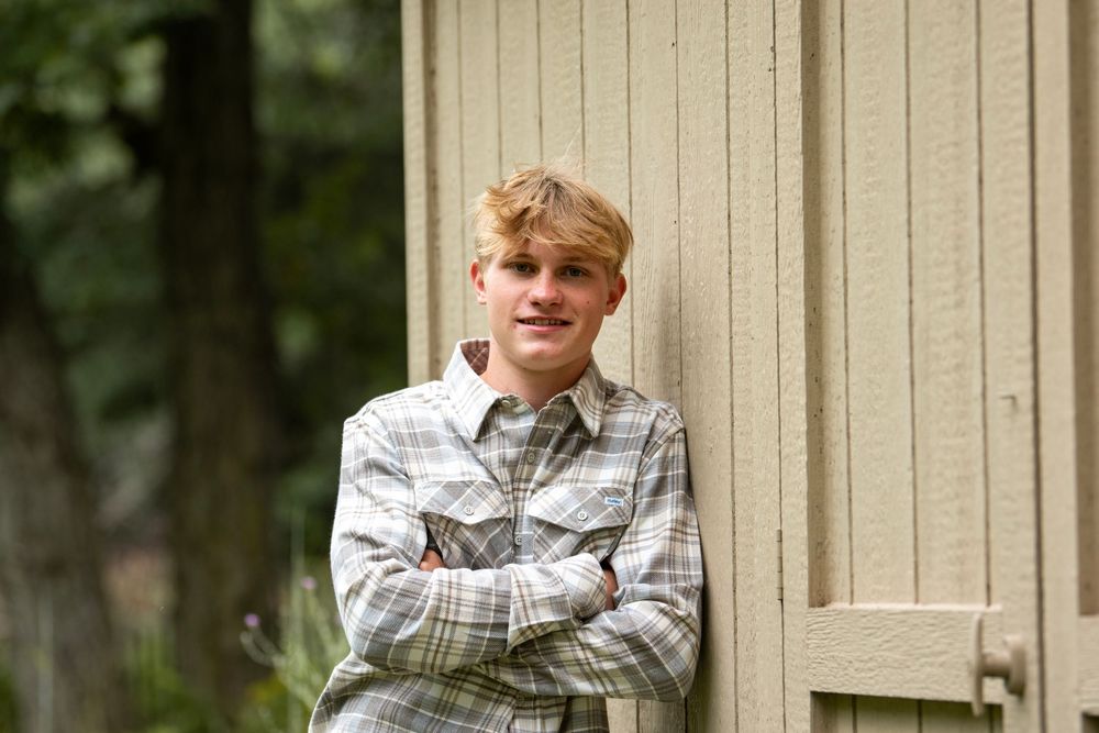 A series of casual portraits in front of a beige wall with a plaid shirt.