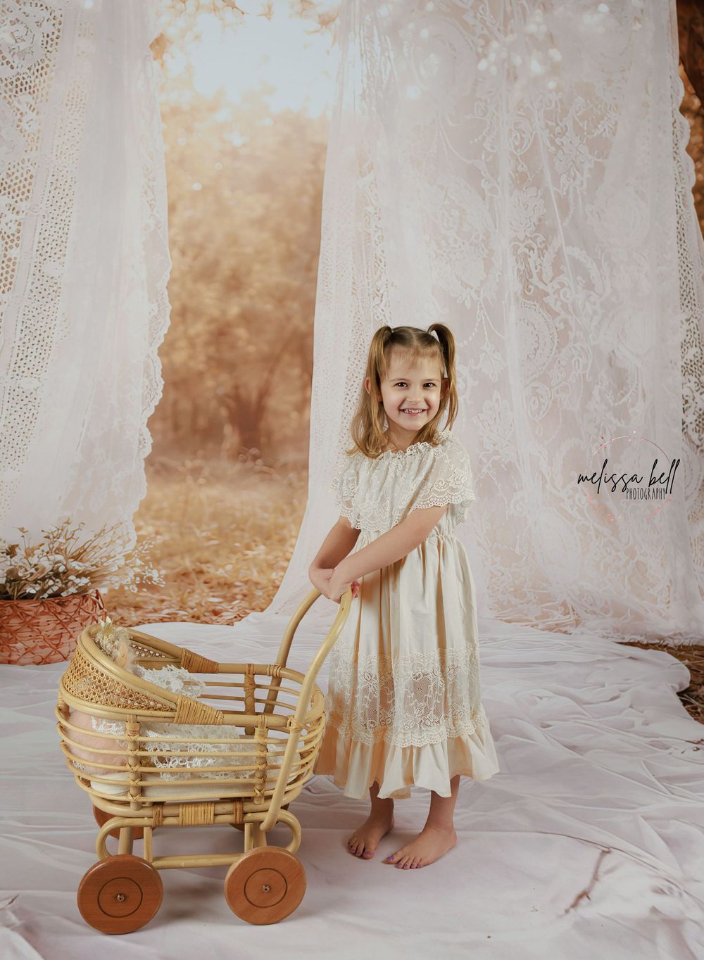 A series of vintage-style photos showing a cream-colored dress and wicker wagon against a soft neutral backdrop.