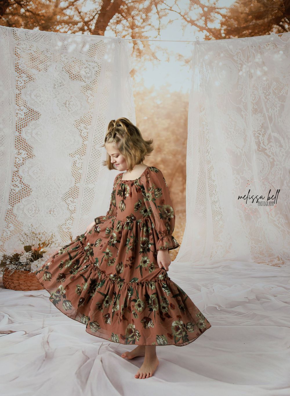 A floral patterned brown dress with ruffled sleeves is displayed on a white lace backdrop in multiple angles.