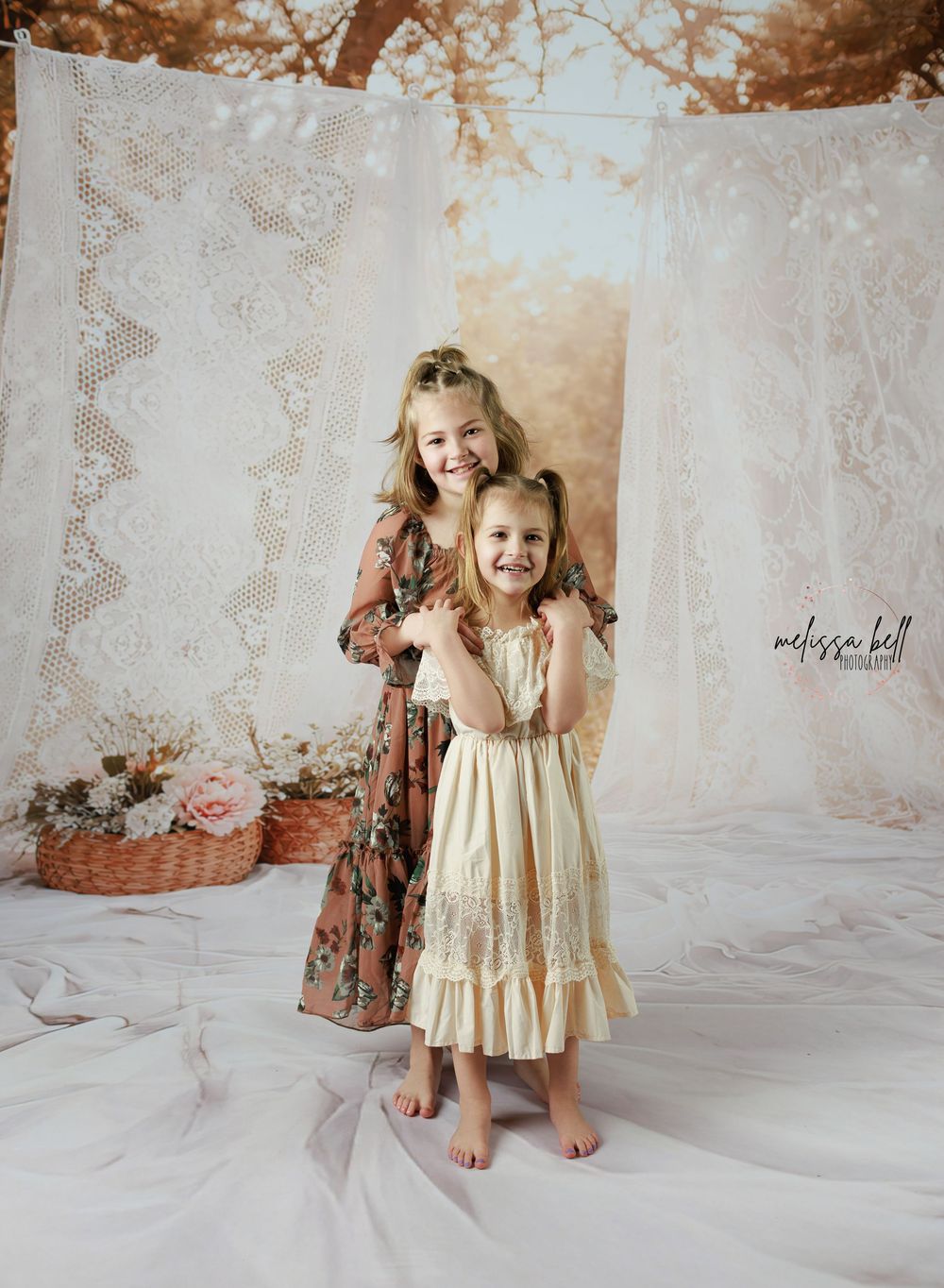 A series of vintage-toned studio portraits showing a small child in a cream-colored dress against a textured backdrop.