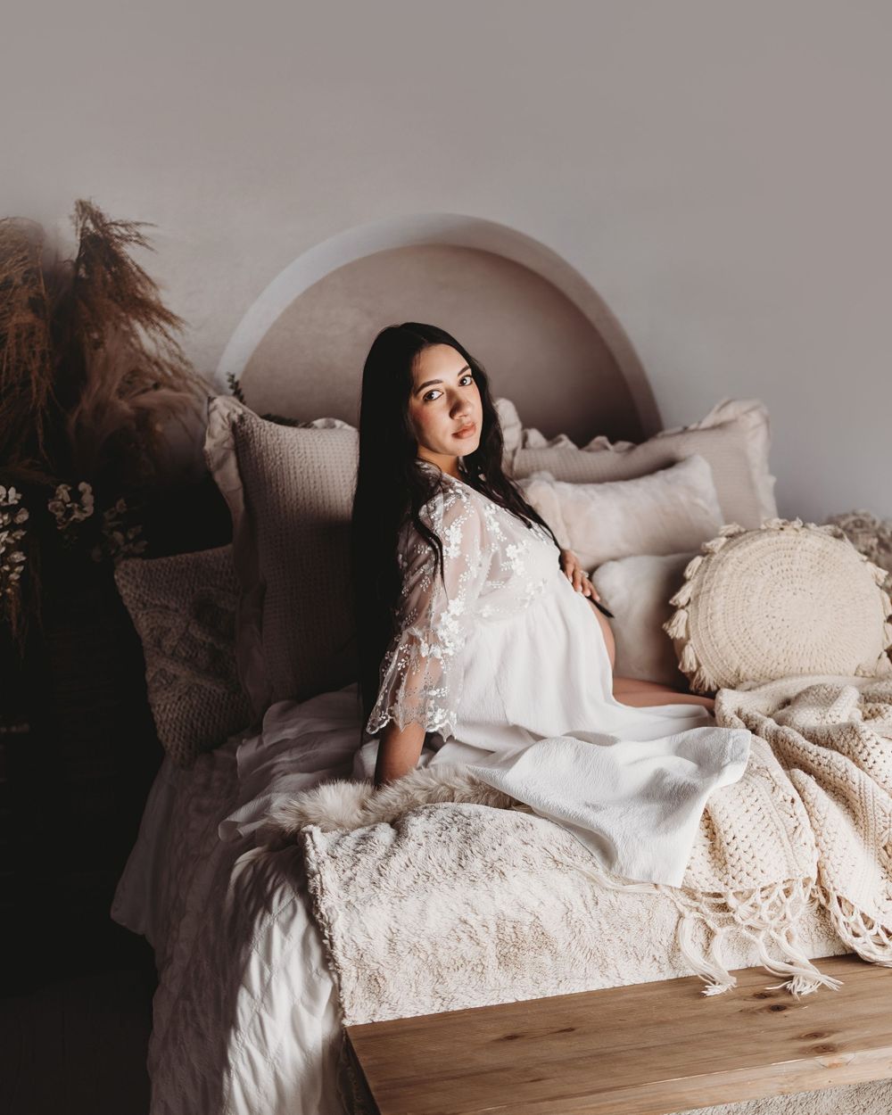Dreamy boudoir photography on vintage chaise lounge with soft natural lighting.