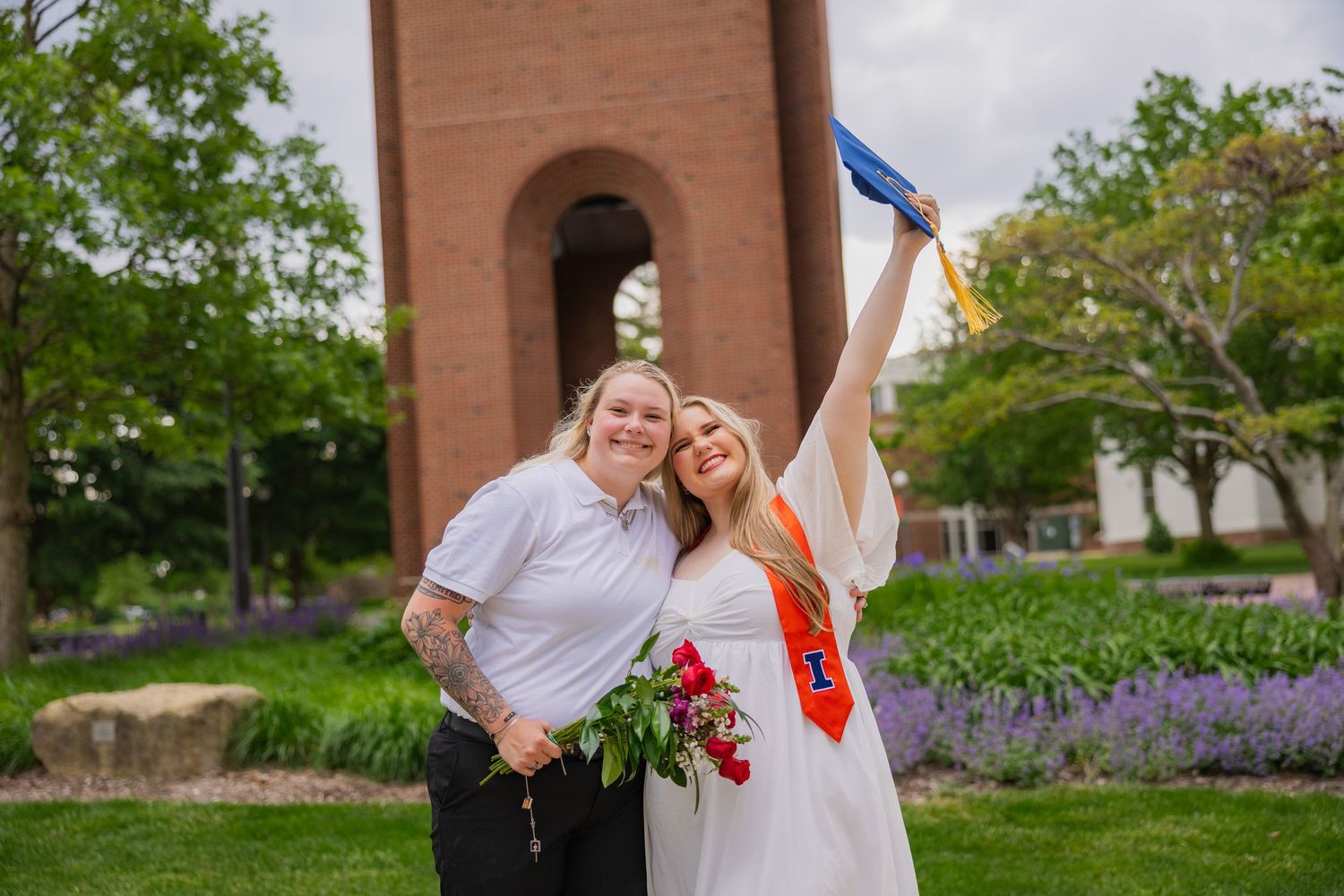 Two girls smiling and celebrating graduation at the University of Illinois