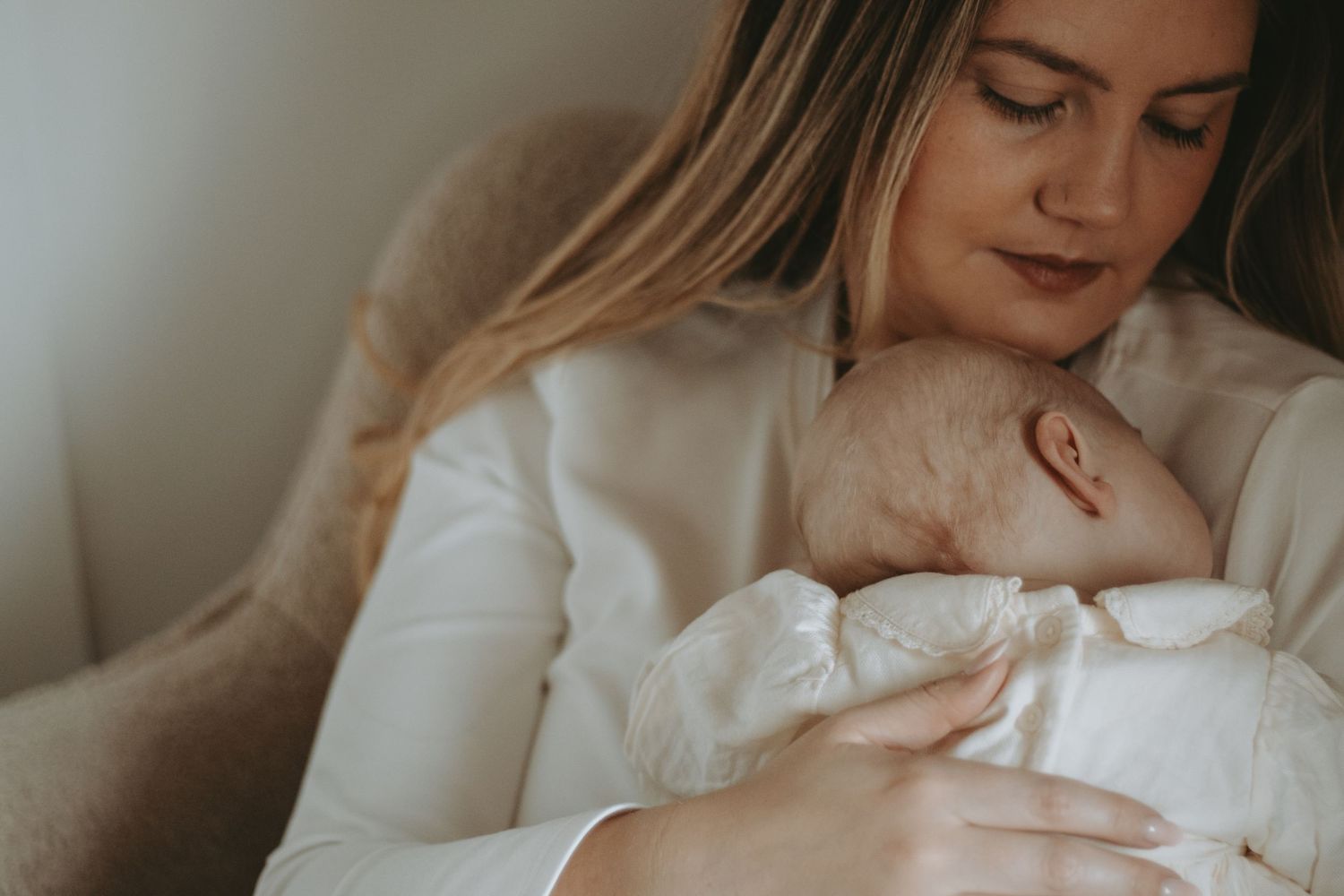 Gentle moments captured in soft natural light with white clothing.