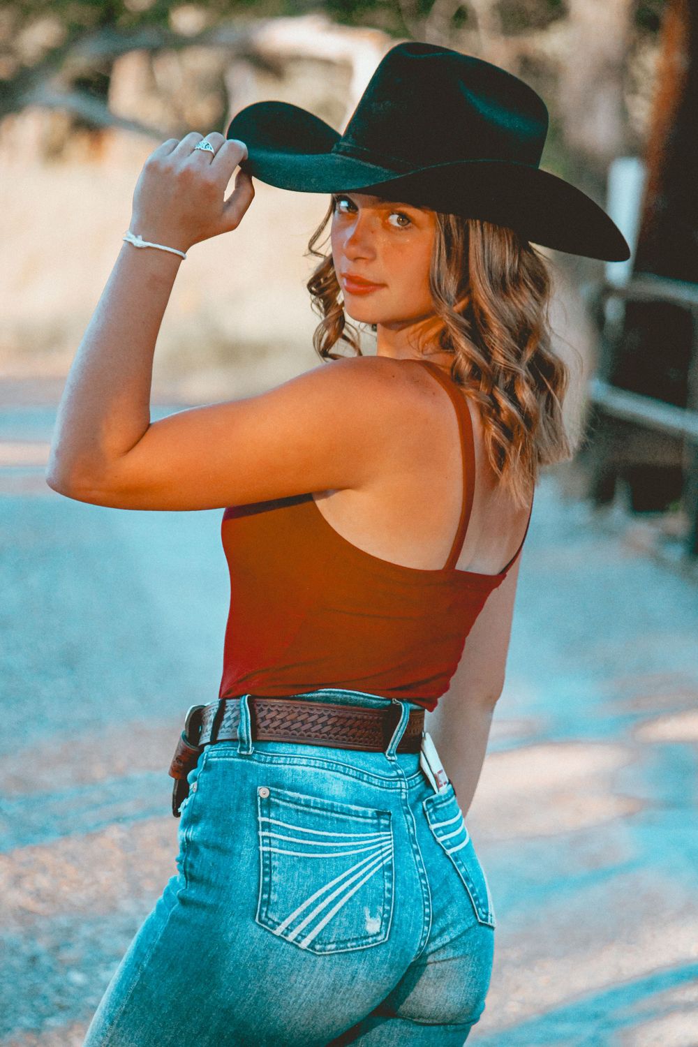 A musician poses outdoors in natural light, captured with warmth and style, reflecting creativity, passion, and authentic expression.