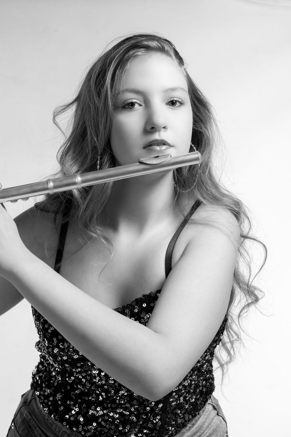 Black and white in studio Musician portrait with her flute.
