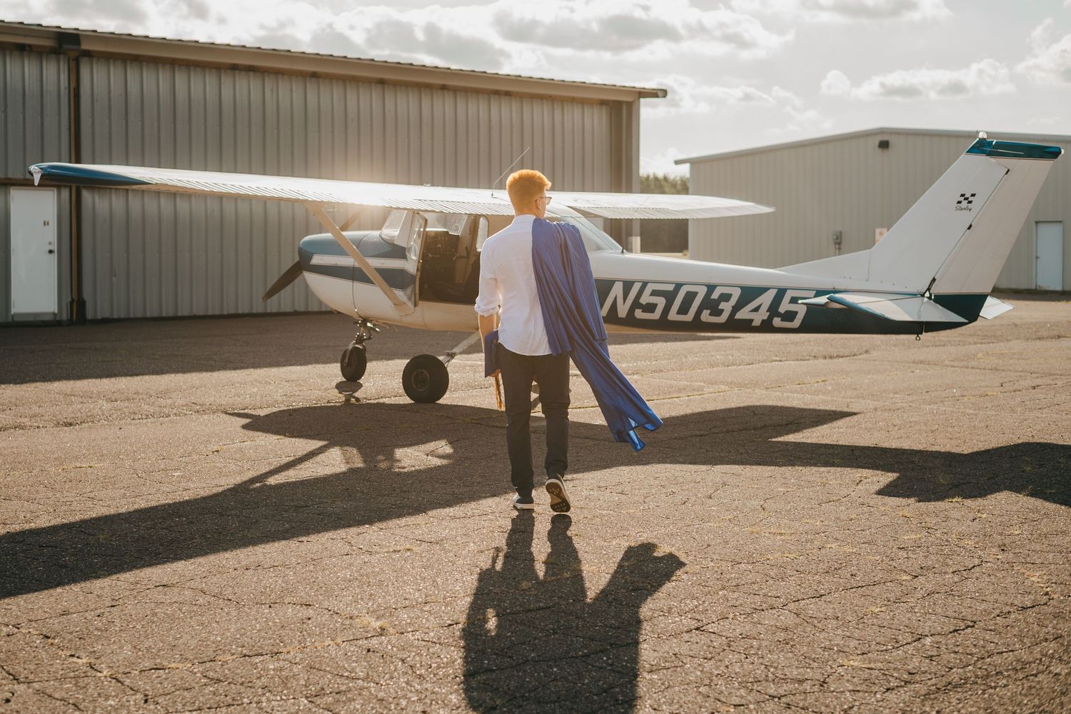 Best senior grad photographer, Duluth MN, senior grad photos with airplane, Duluth MN