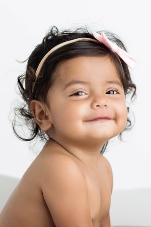 Portrait photography session of adorable 8 month old baby girl.