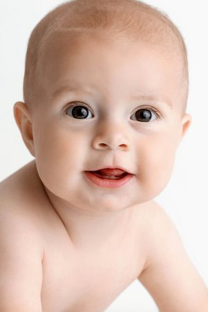 Portrait of adorable smiling baby boy.