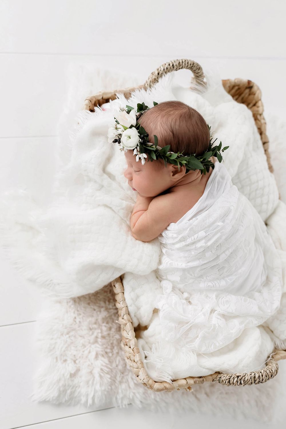 Beautiful newborn photo of sleeping baby girl by professional photographer in Menifee California.