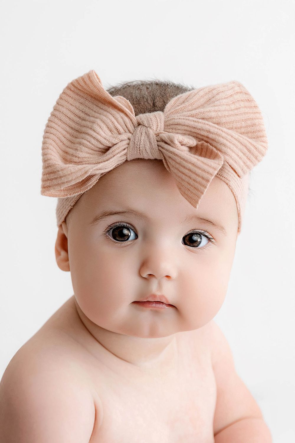Menifee baby photographer portrait of cute baby girl in professional photography studio.