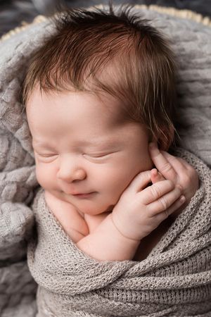 Portrait of sleeping baby boy in Lake Elsinore newborn photography studio.