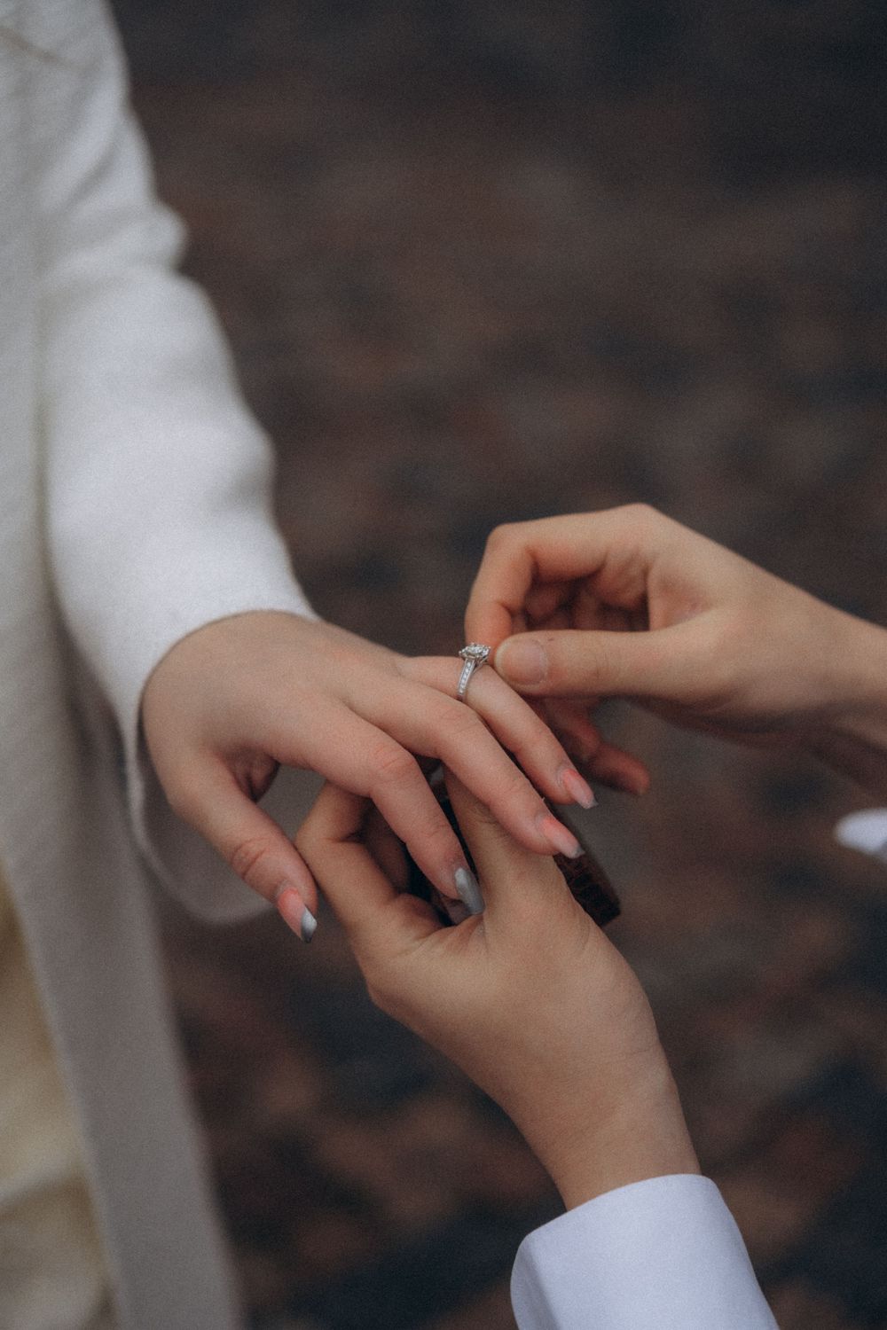 Close-up of an engagement ring during a proposal at Helsinki Cathedral