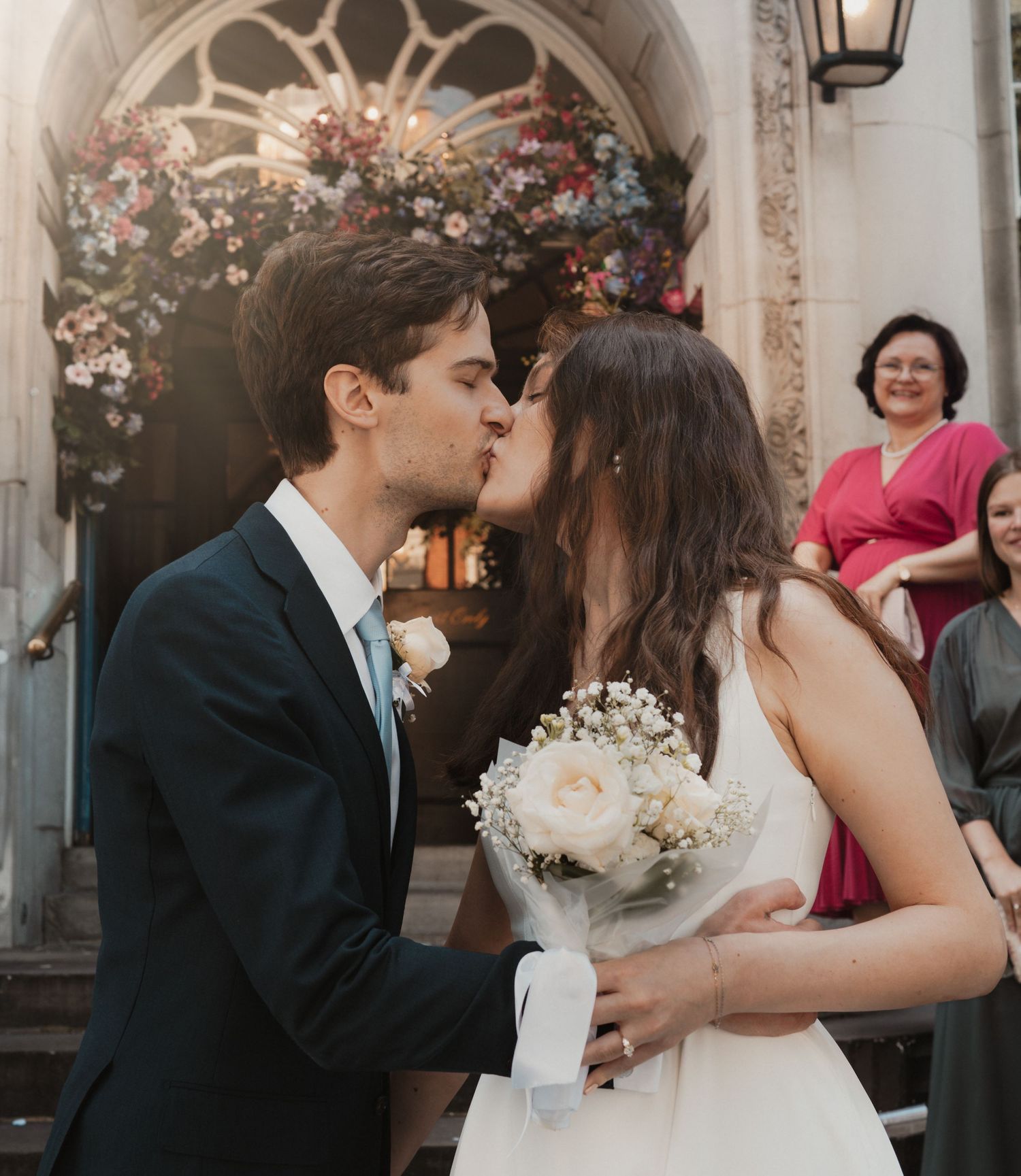 Couple kissing on the steps of Old Chelsea Town Hall at an intimate wedding captured by Shayla Bloom Photography