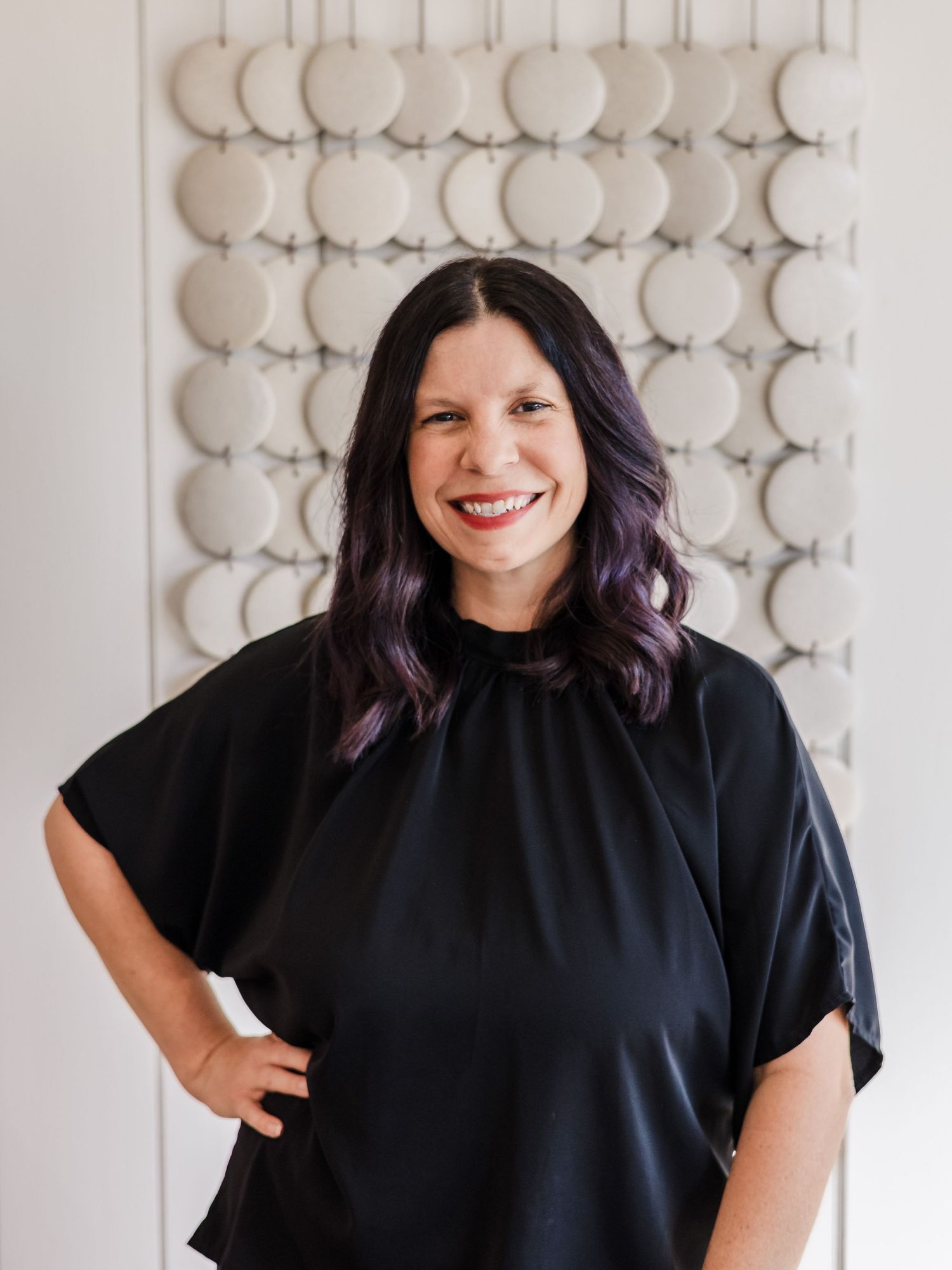 A professional and radiant headshot of the owner of Distilled Focus Photography, a lifestyle and wedding photographer based in Buda, Texas.