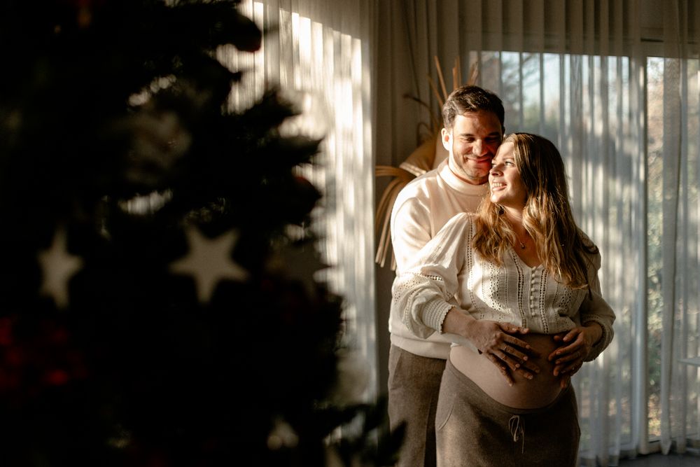 A romantic couple shares tender moments in a dimly lit room with star-shaped lights creating a magical atmosphere.
