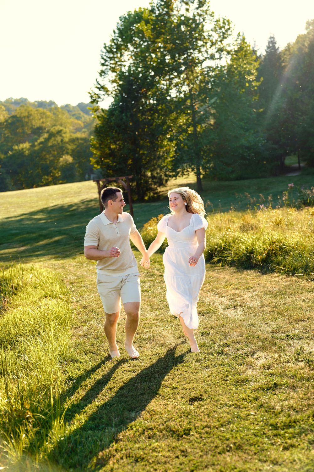 Maggie & Andrew's golden hour engagement at The Hangar wedding venue in Hocking Hills in Logan Ohio. Cincinnati Wedding Photographer
