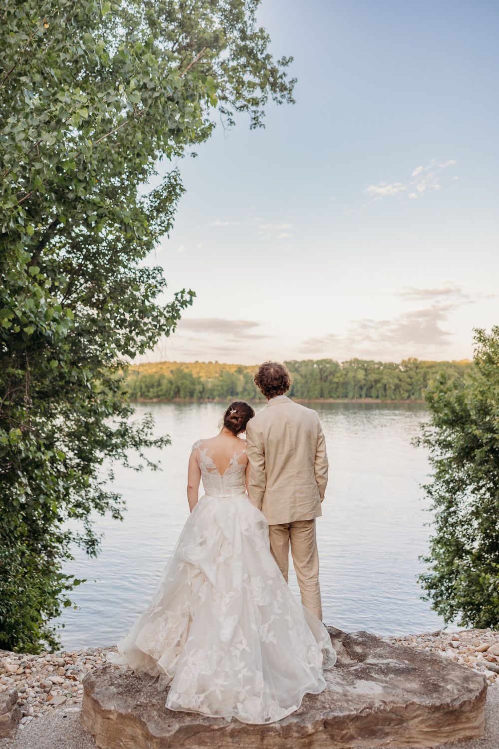 Bride and groom looking out at Ohio River. Storytelling wedding photo at The Inn at Oneonta in Northern Kentucky.