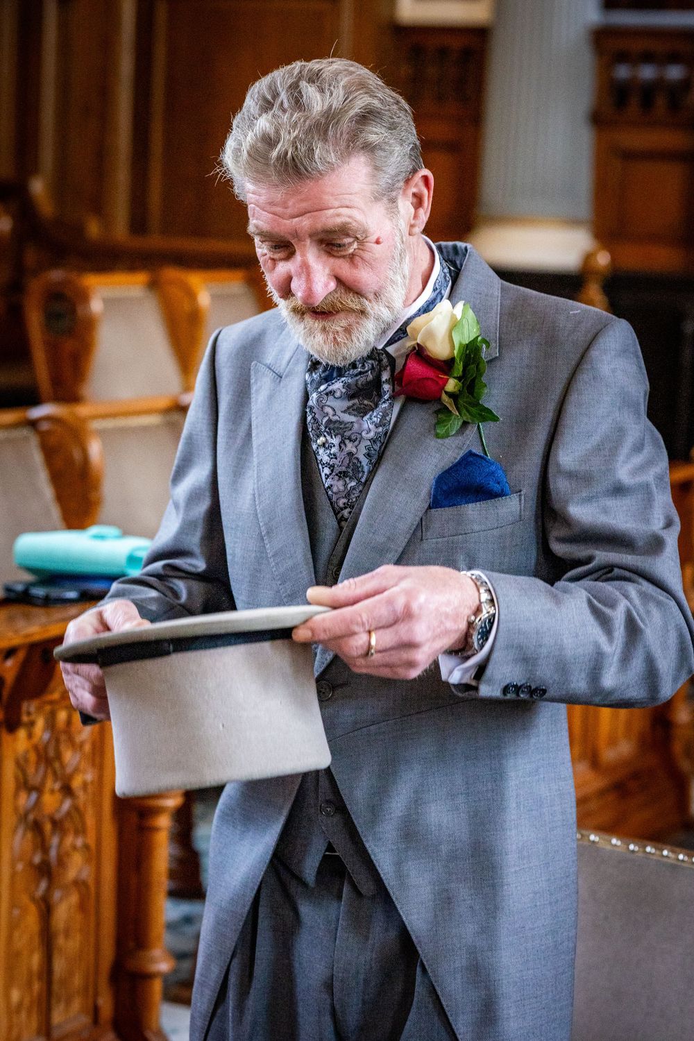 Older gentleman adjusting top hat
Groom adjusting grey top hat during ceremony at Southport Town Hall wedding in Merseyside
