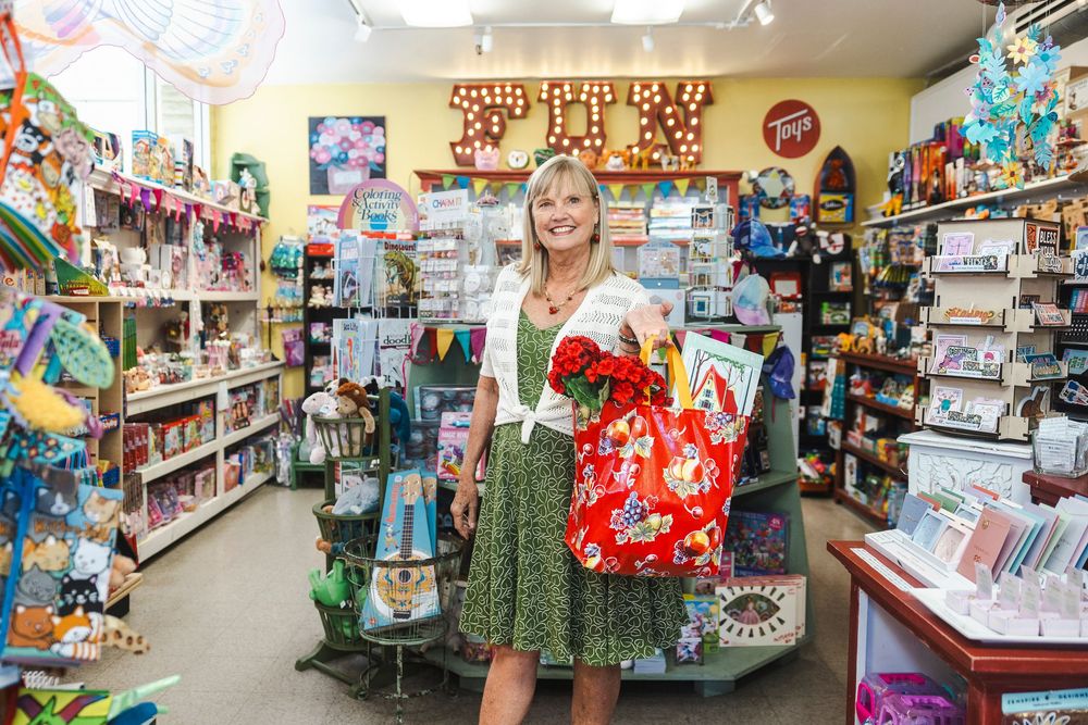 Retail store interior displaying rows of merchandise, decorative items, and gift products on well-organized shelves.