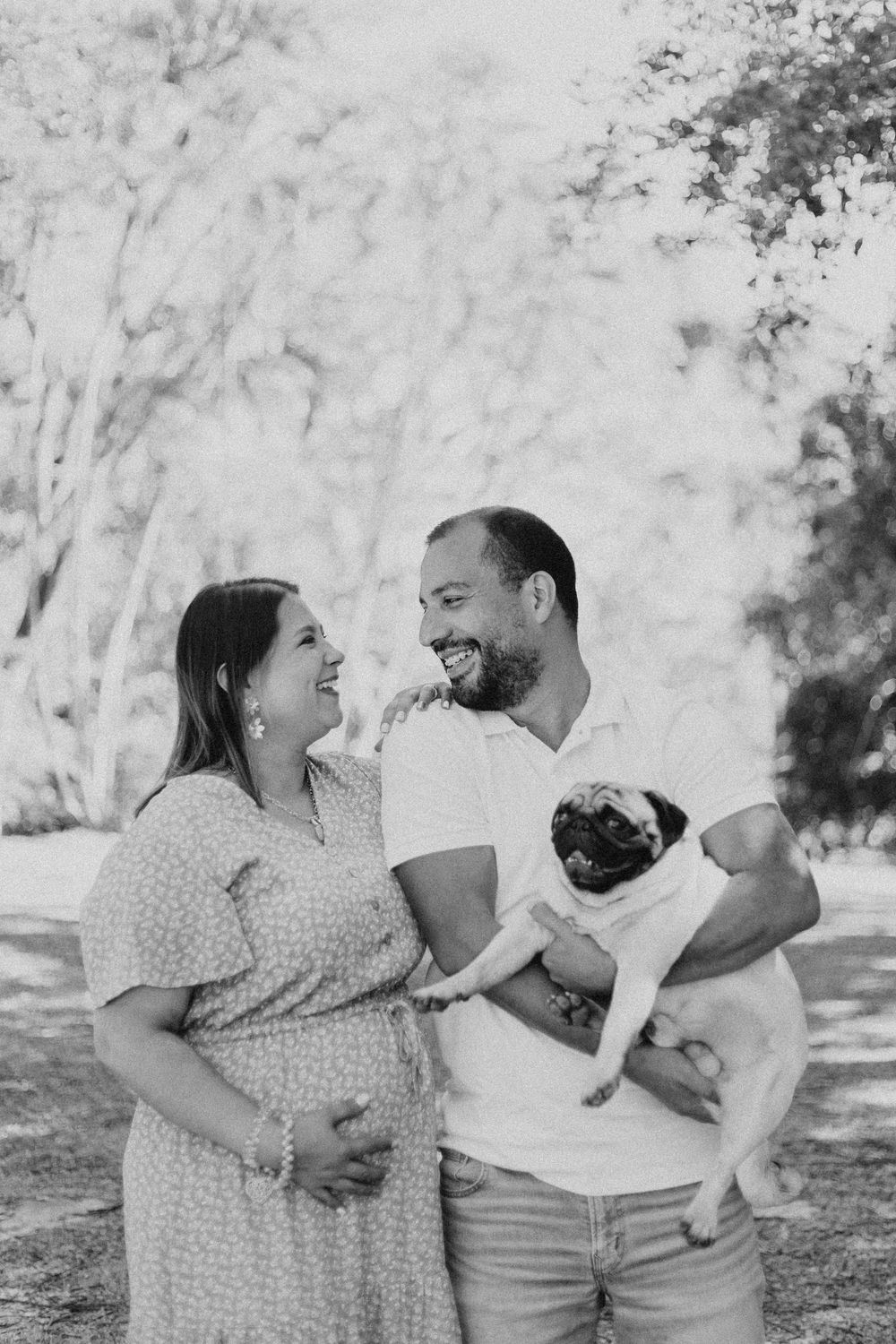 A couple in casual attire shares joyful moments outdoors with their pug dog in a series of candid photos.