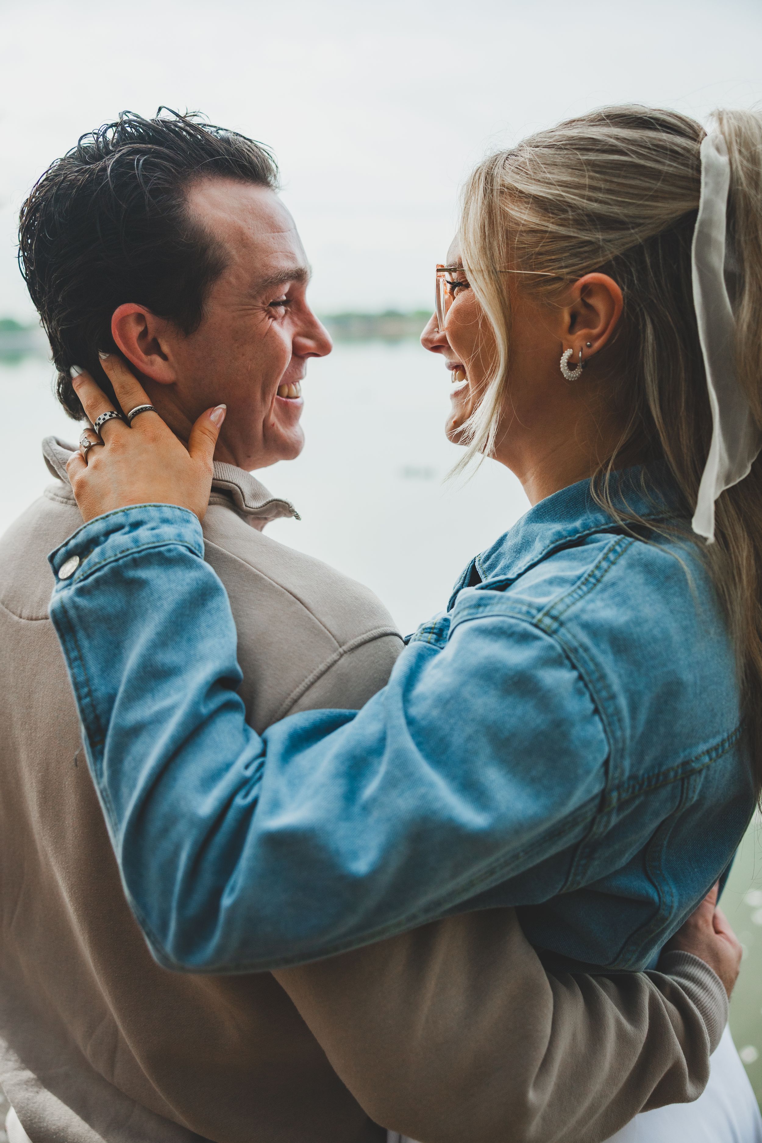 A couple in casual attire sharing a romantic moment together in a sequence of intimate embraces.