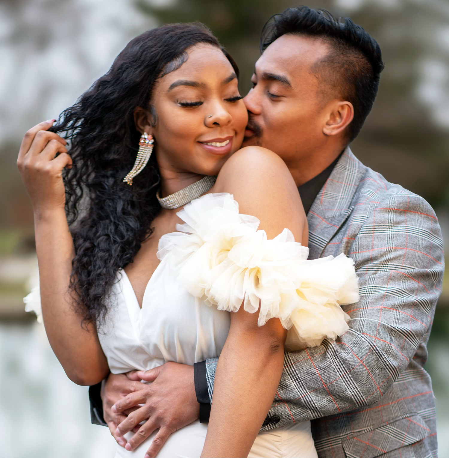 A romantic moments between an engaged couple during an engagement photo session