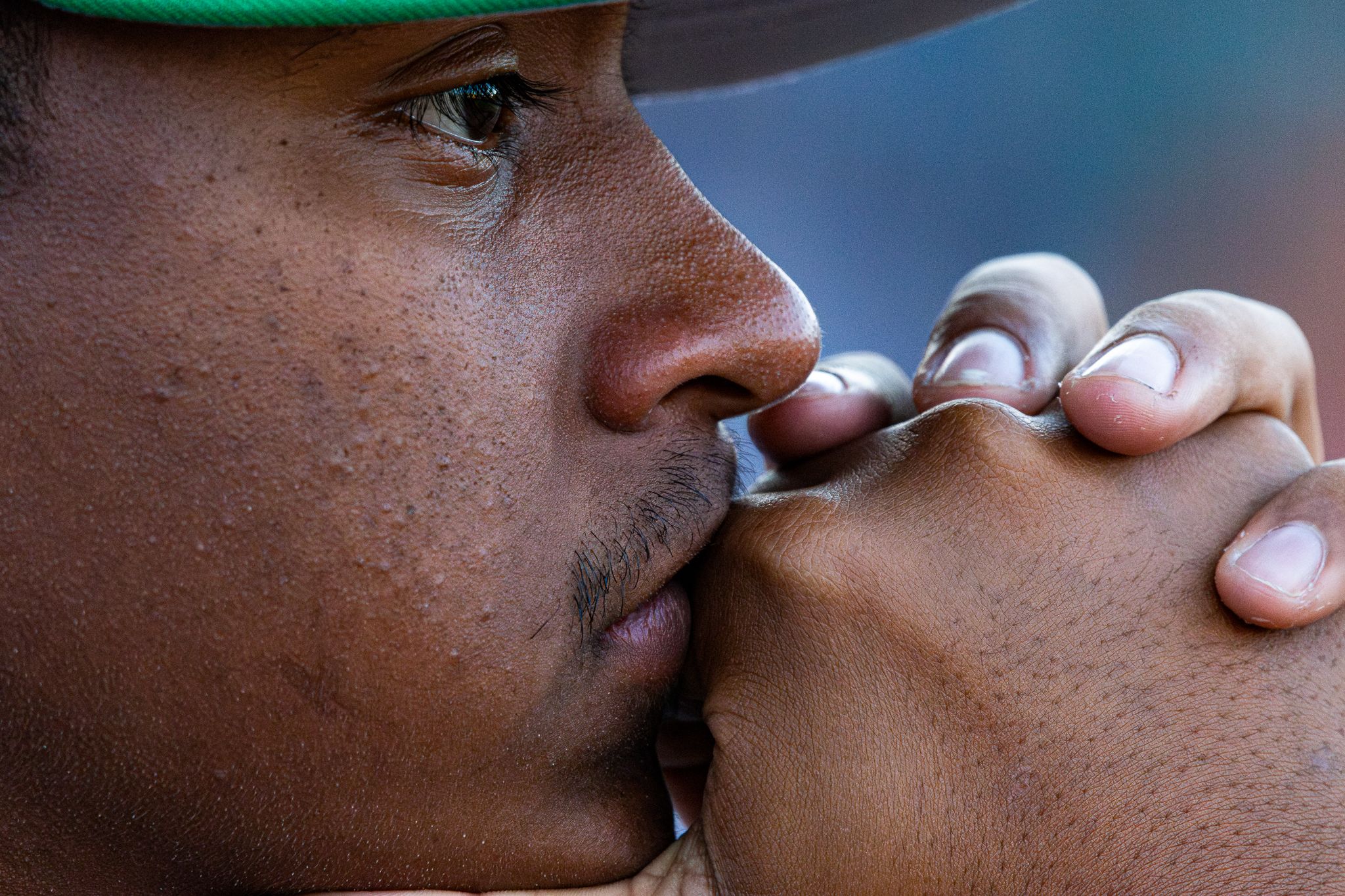 Close up photo showing a baseball player in contemplation