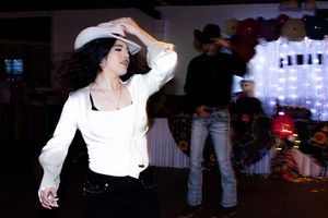 A collage of seven black and white photographs showing people dancing at what appears to be a party or celebration.