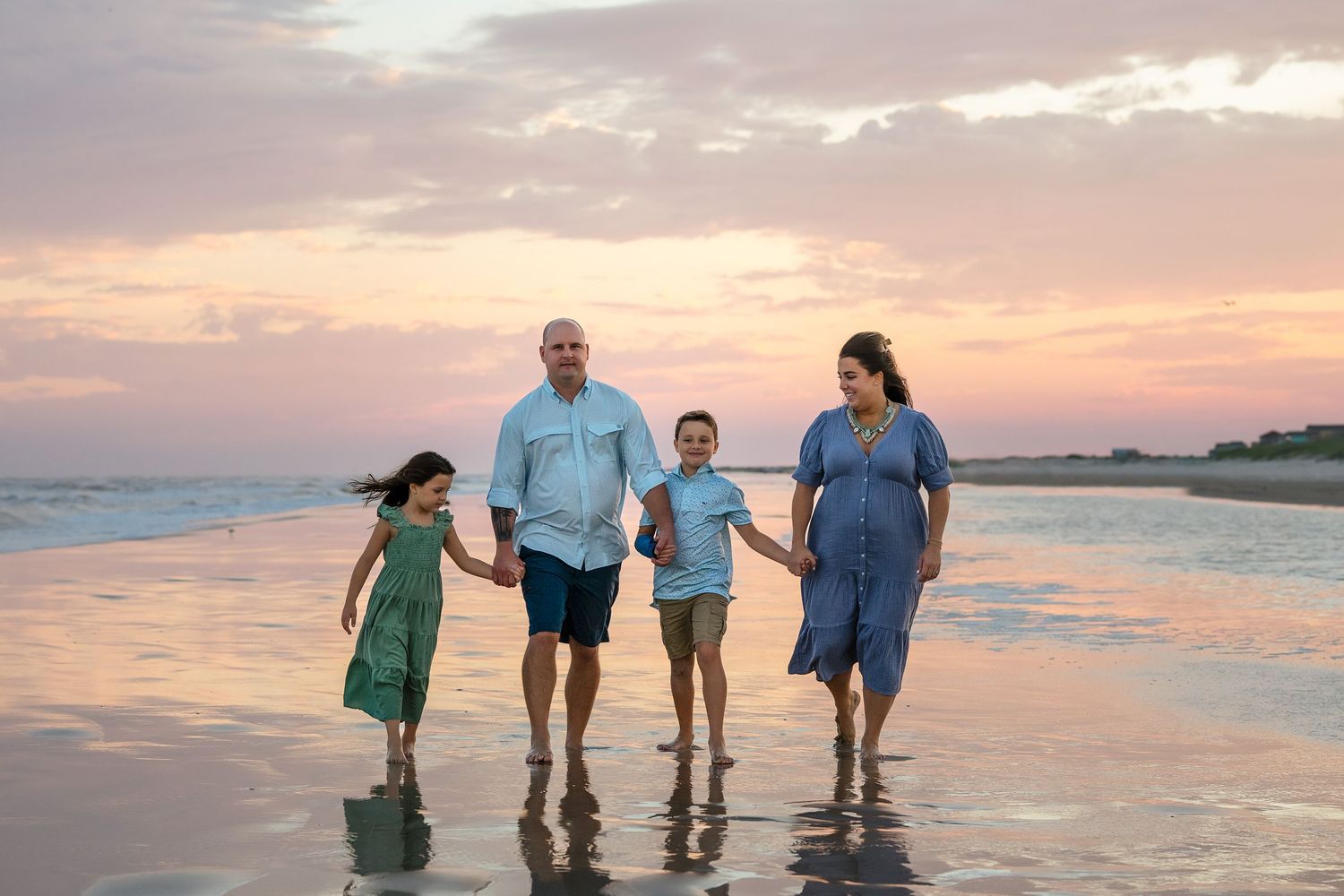 Family walking down Matagorda Beach during Matagorda Beach Photo session.