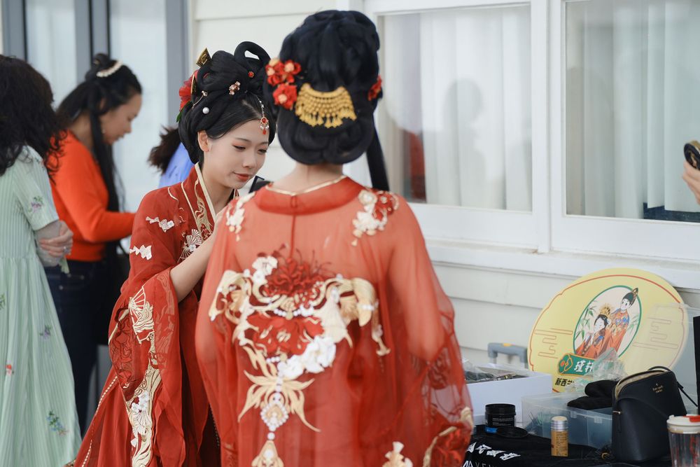 Group photo of performers in Hanfu at a Chinese Traditional Music Concert, captured by an Auckland event photographer.