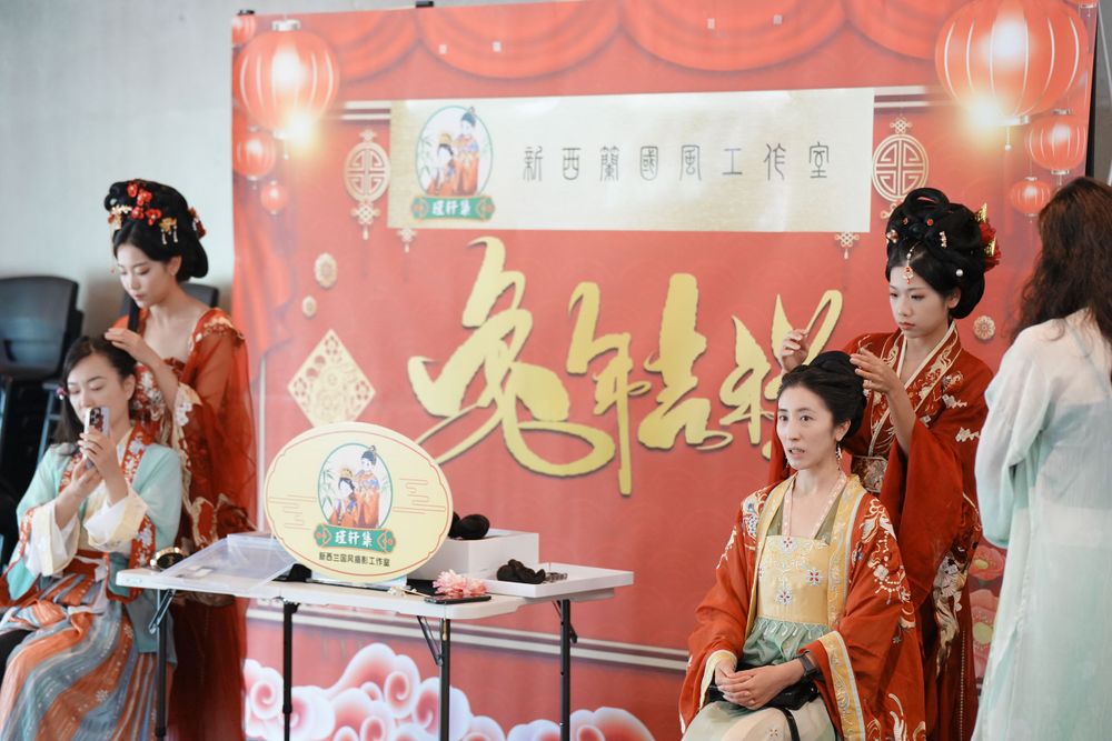 Group photo of performers in Hanfu at a Chinese Traditional Music Concert, captured by an Auckland event photographer.