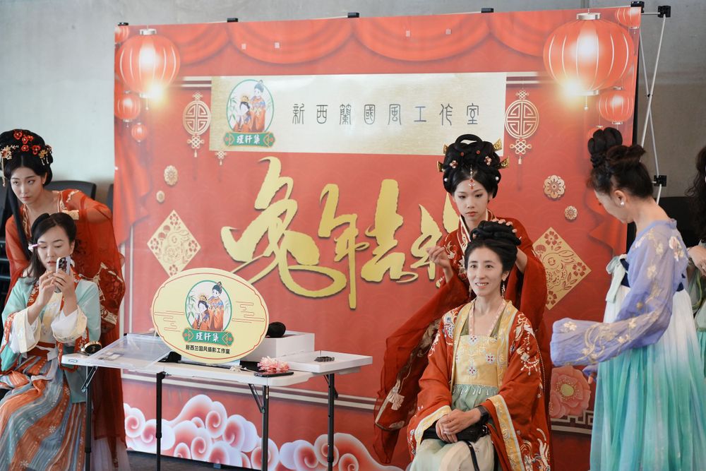 Group photo of performers in Hanfu at a Chinese Traditional Music Concert, captured by an Auckland event photographer.