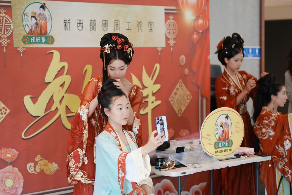 Group photo of performers in Hanfu at a Chinese Traditional Music Concert, captured by an Auckland event photographer.