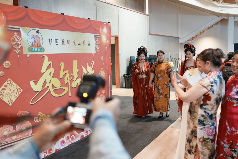 Group photo of performers in Hanfu at a Chinese Traditional Music Concert, captured by an Auckland event photographer.