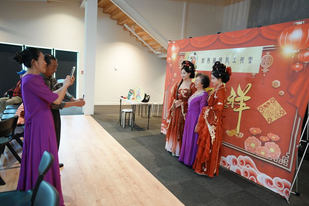 Group photo of performers in Hanfu at a Chinese Traditional Music Concert, captured by an Auckland event photographer.