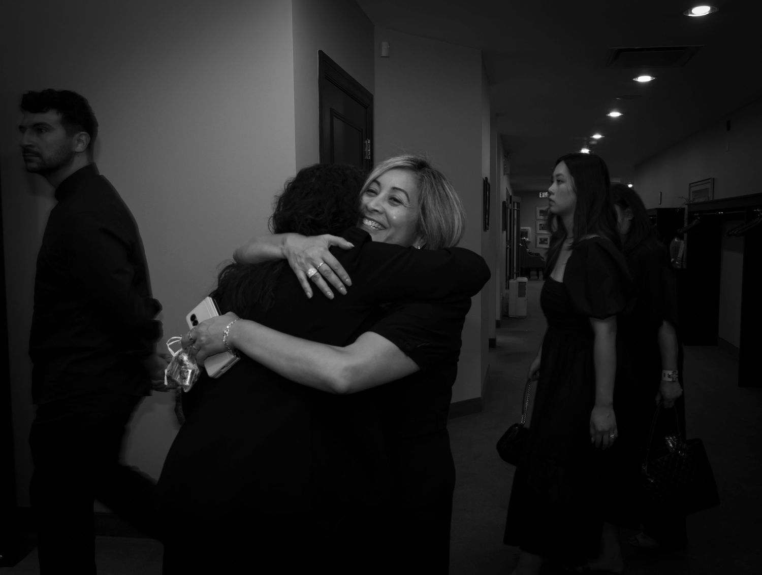 Black and white photo of two women hugging