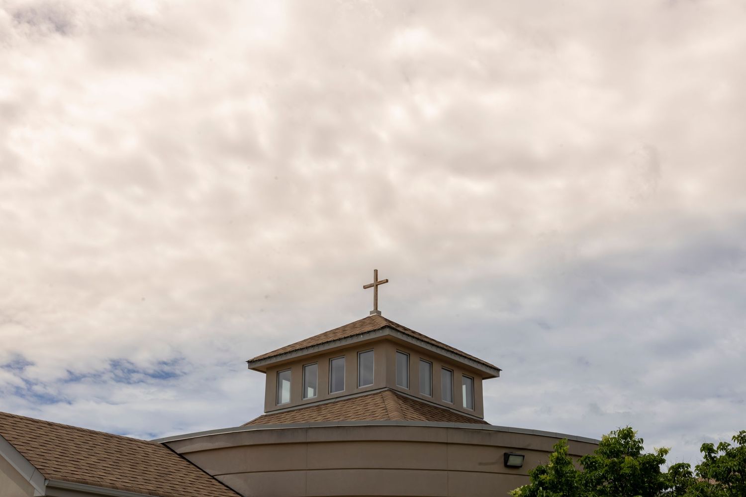 Church; Cross in front of yellow/blue sky