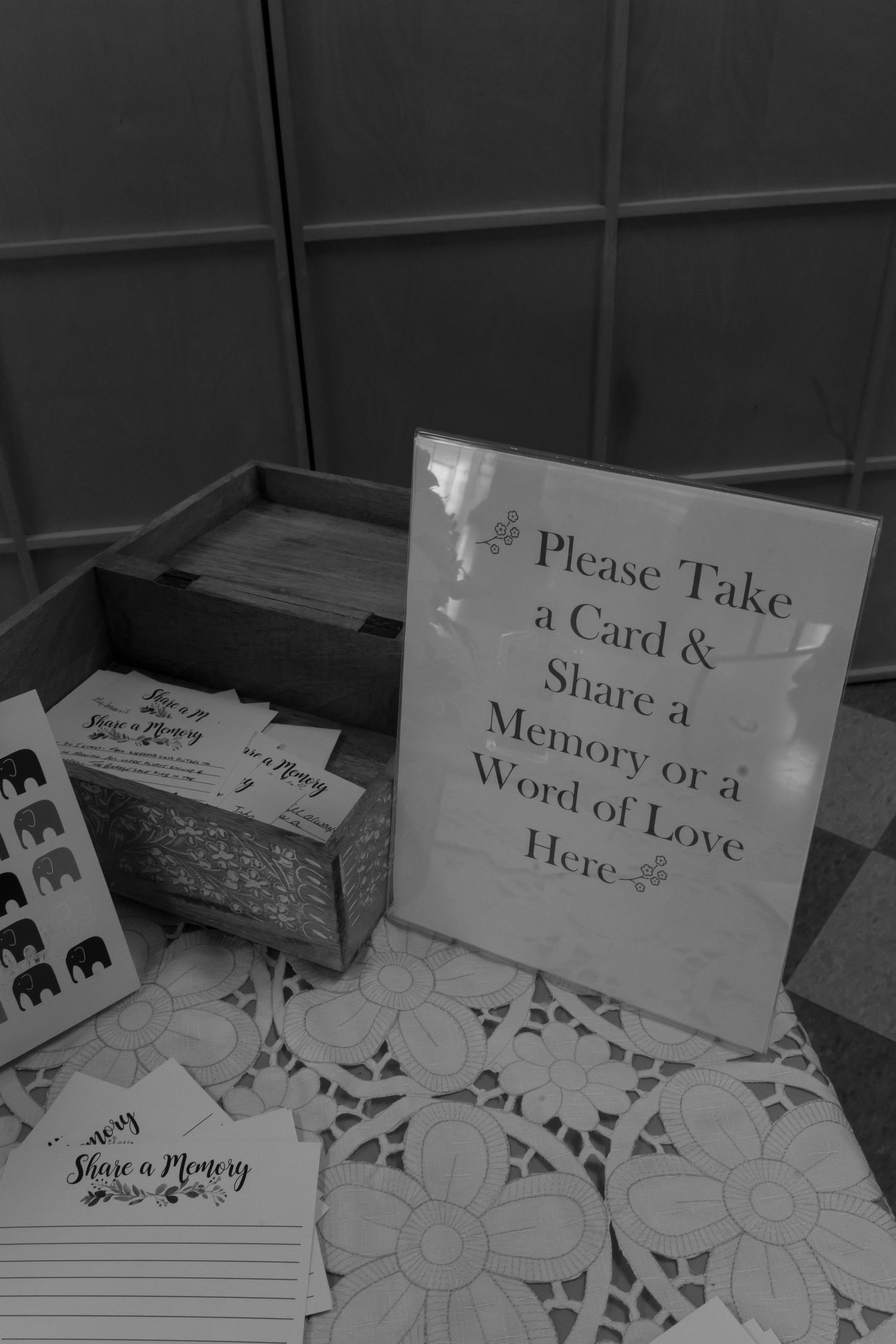 Black and white photo of sign on a table