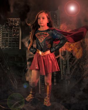 Dramatic superhero portrait in Supergirl costume against apocalyptic city background.